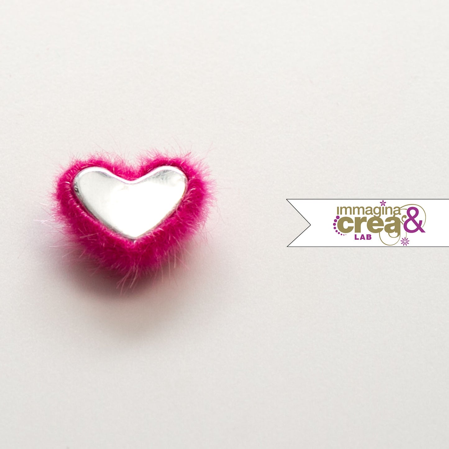 PELOSETTO A CUORE ROSA ACCESO